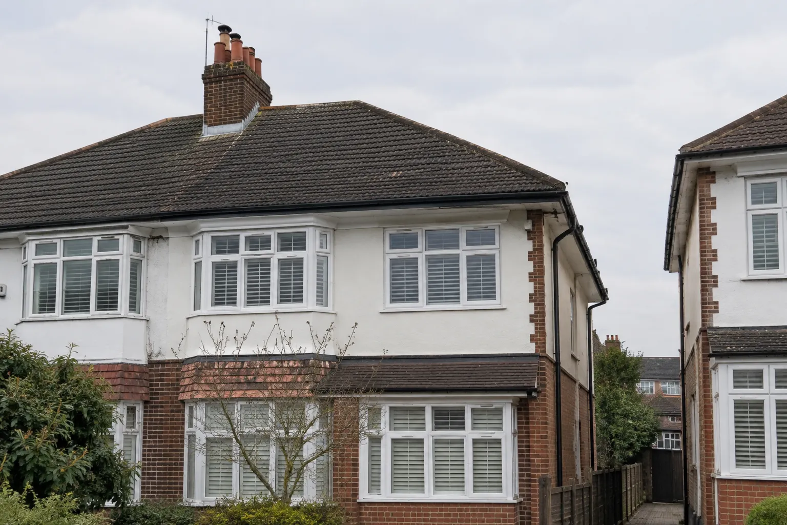 A semi-detached house roof seen from the street